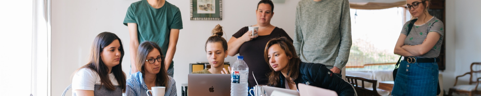 group of people watching on laptop 1595385