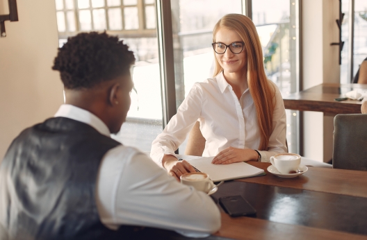 man being interviewed by a woman 3874035