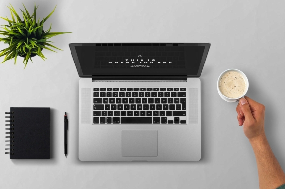 man using laptop on table against white background 257897